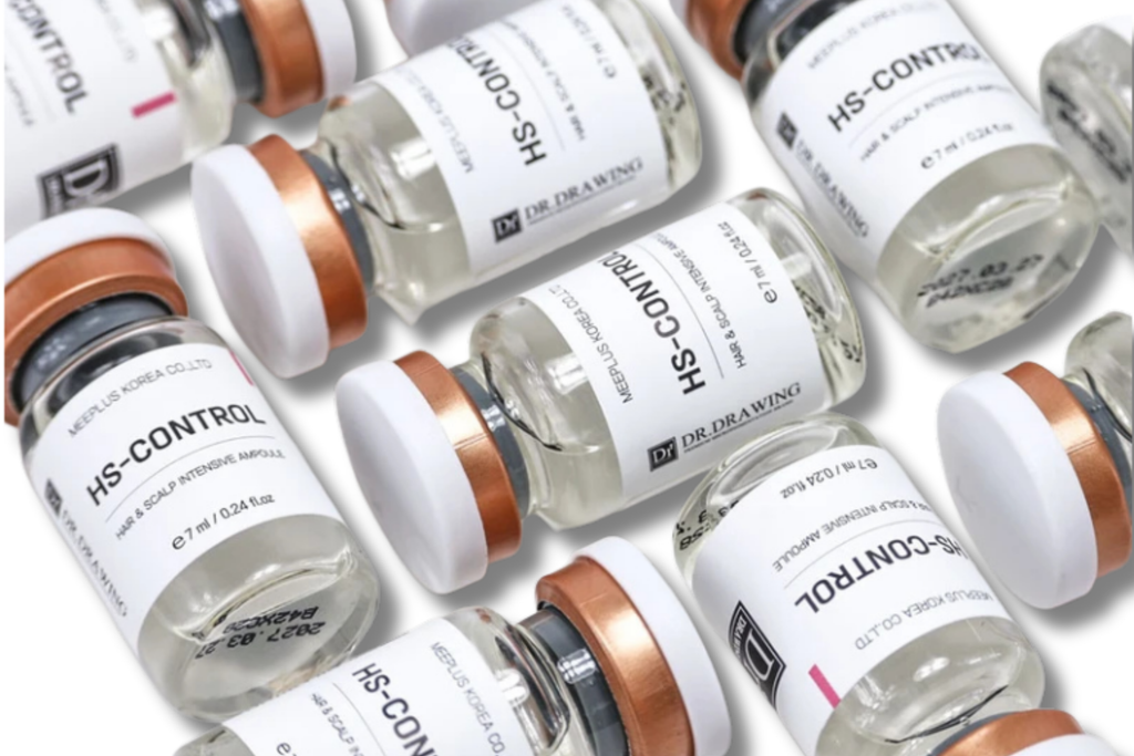 Several clear glass vials labeled HS-CONTROL and Dr. Ora Winy are arranged on a white background.