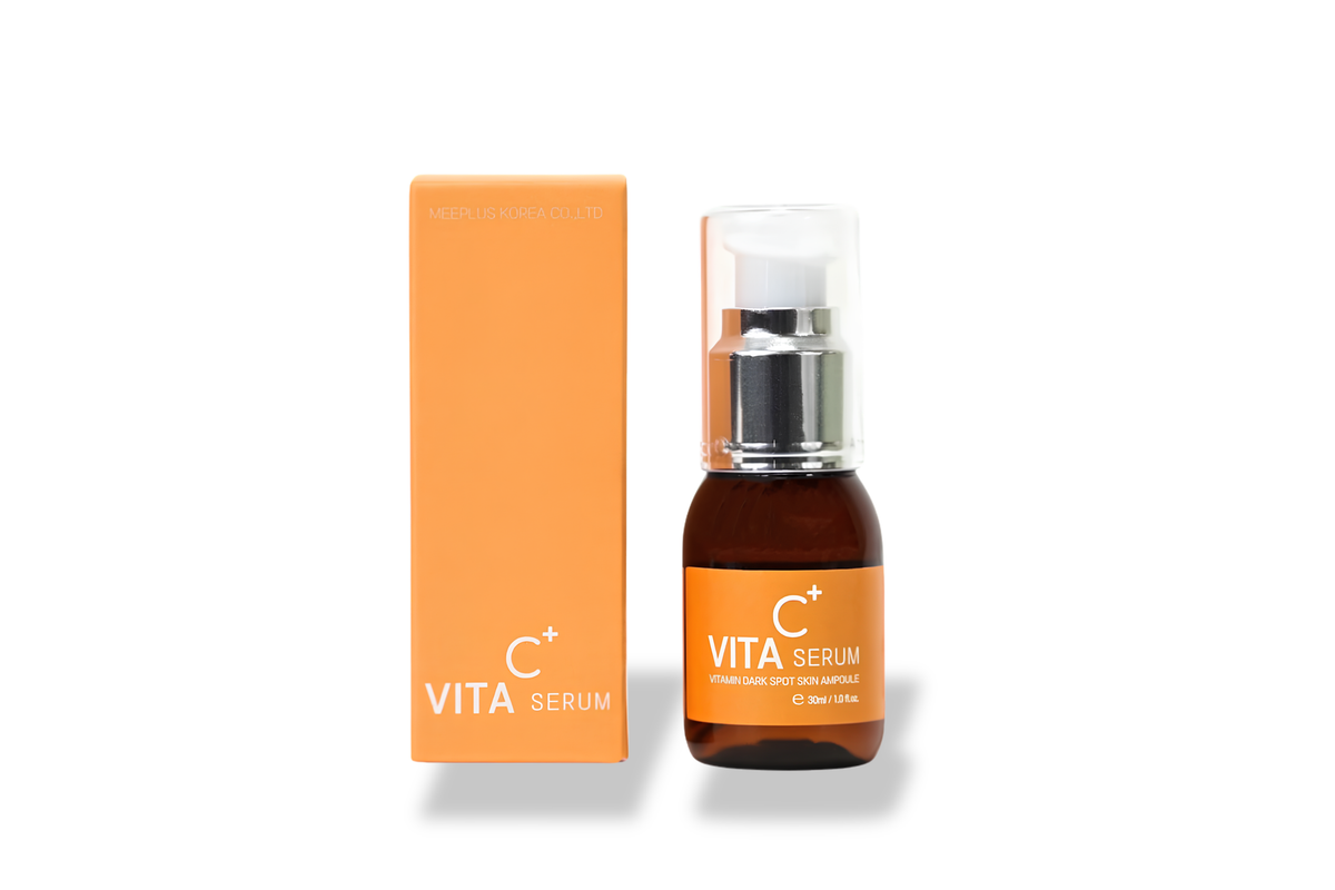 Vita Serum skincare bottle with an amber glass body, white pump, and clear cap, shown next to its orange box on a white background.