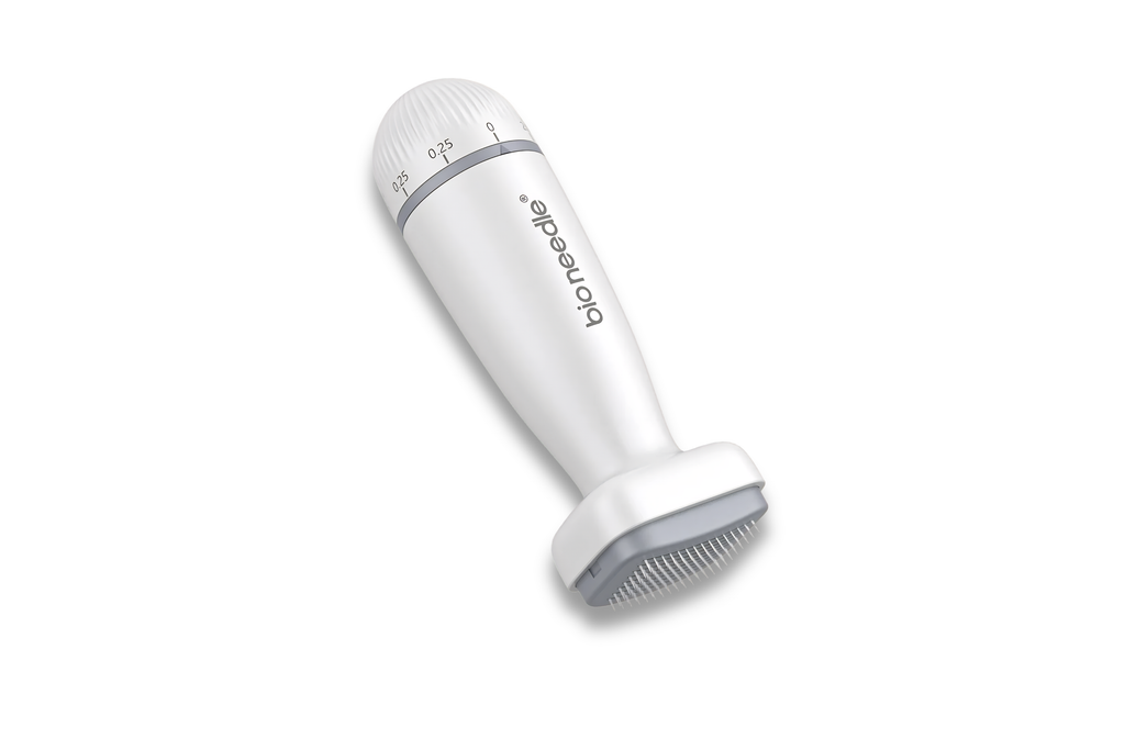 A white and gray Bionicle pet grooming brush with a textured handle and bristle head, shown on a plain white background.