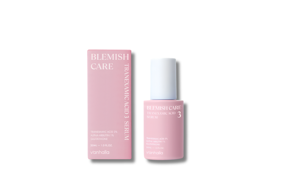 A pink cosmetic serum bottle with a white cap stands next to its matching pink box on a clean white background. The packaging features the text 'BLEMISH CARE' and 'TRIAPEMIC ACID SERUM'.